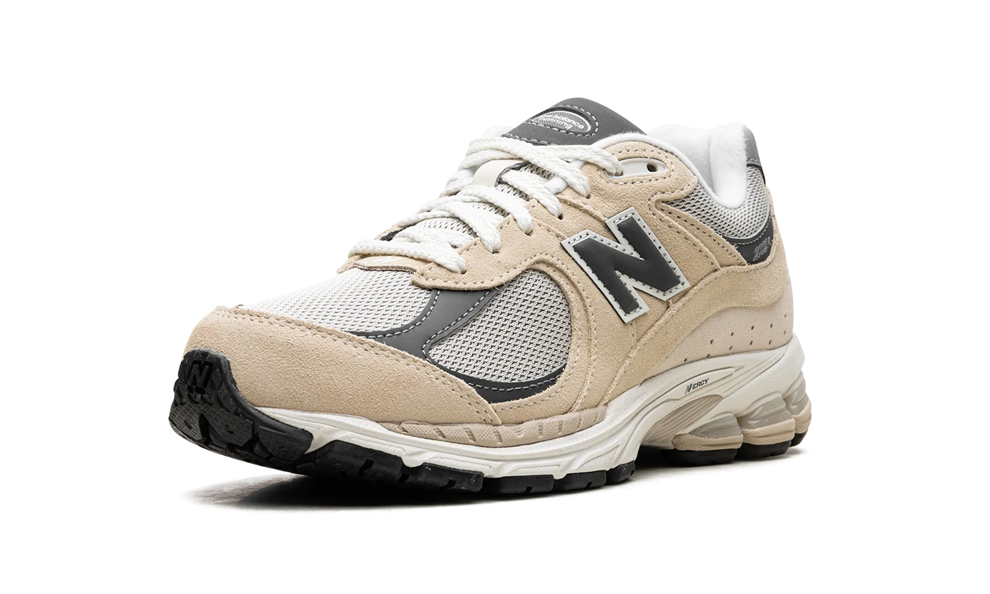 2002R "Sandstone Magnet" running with a gum rubber outsole running in a bus station area shoes