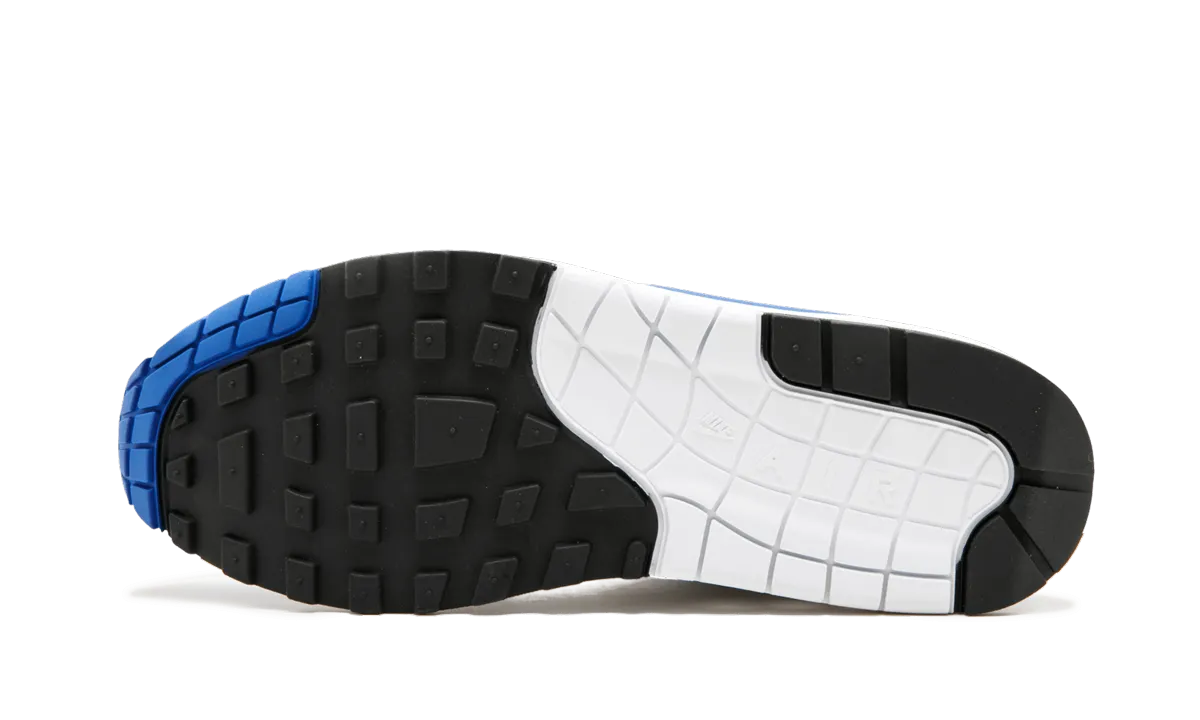 Air Max 1 Anniversary "Royal Blue" running in a boardwalk area shoes used