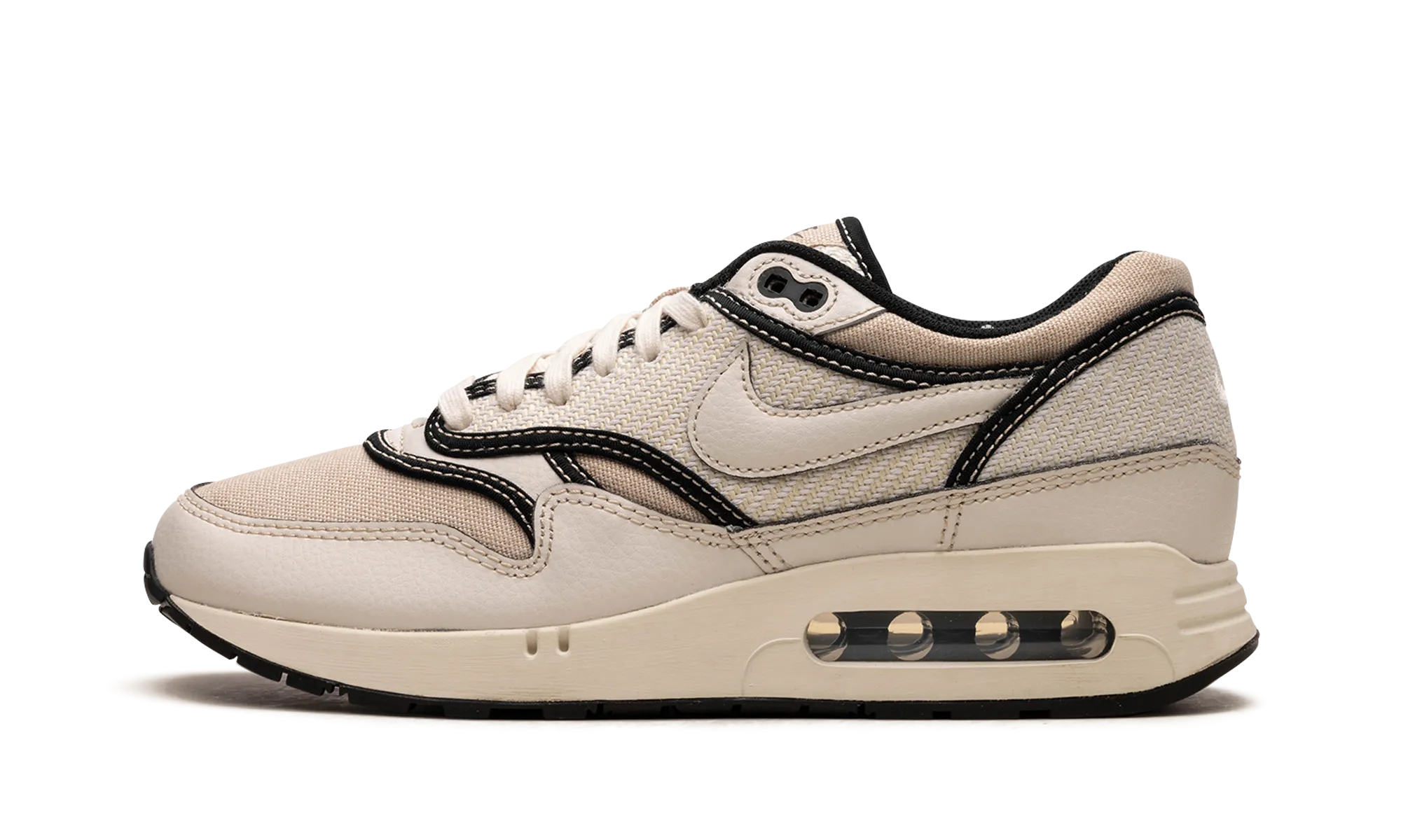Air Max 1 '86 "World Make" running in a softball field area shoes