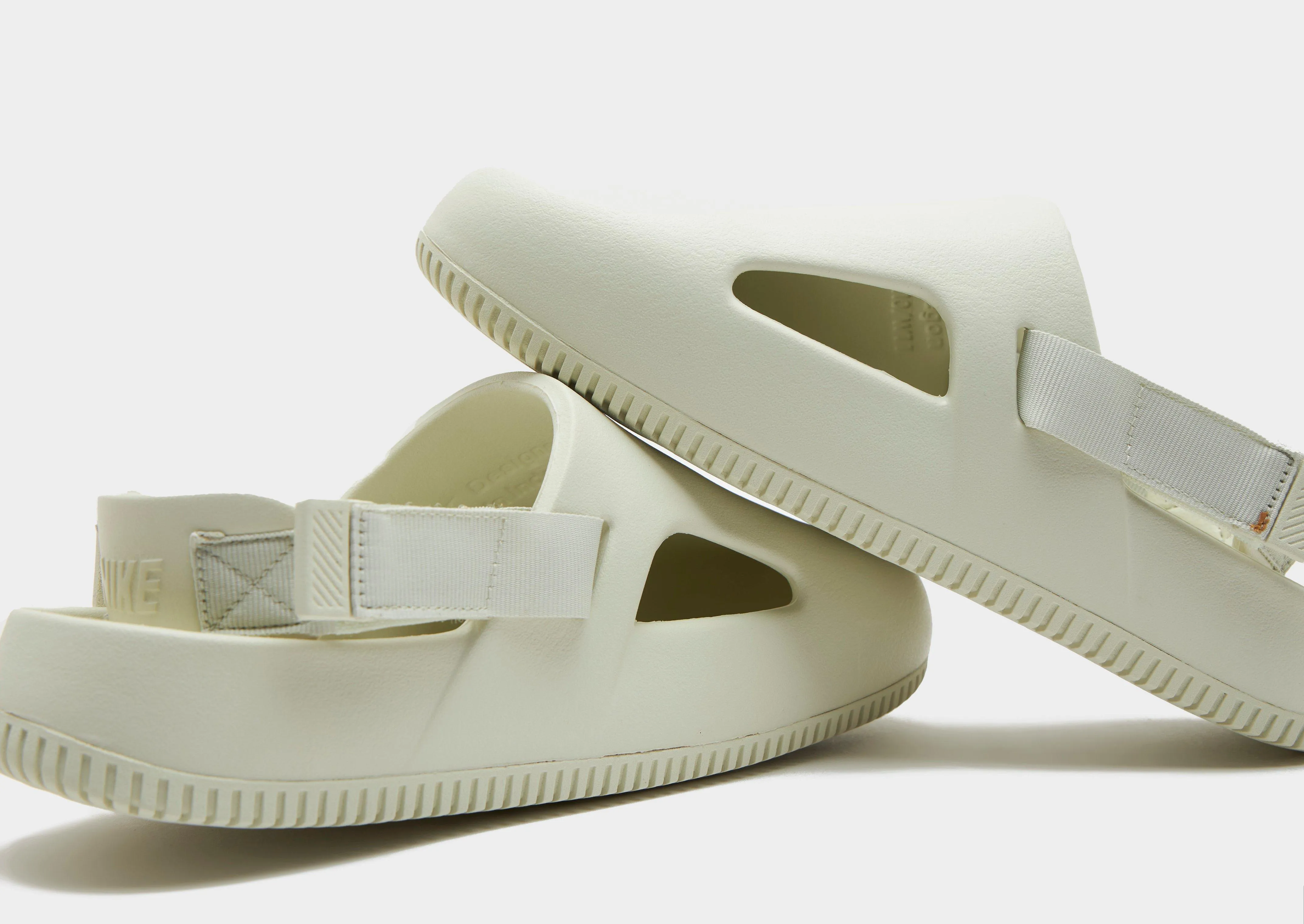 running in a boardwalk area shoes fabric upper shoes Calm Mules Slide