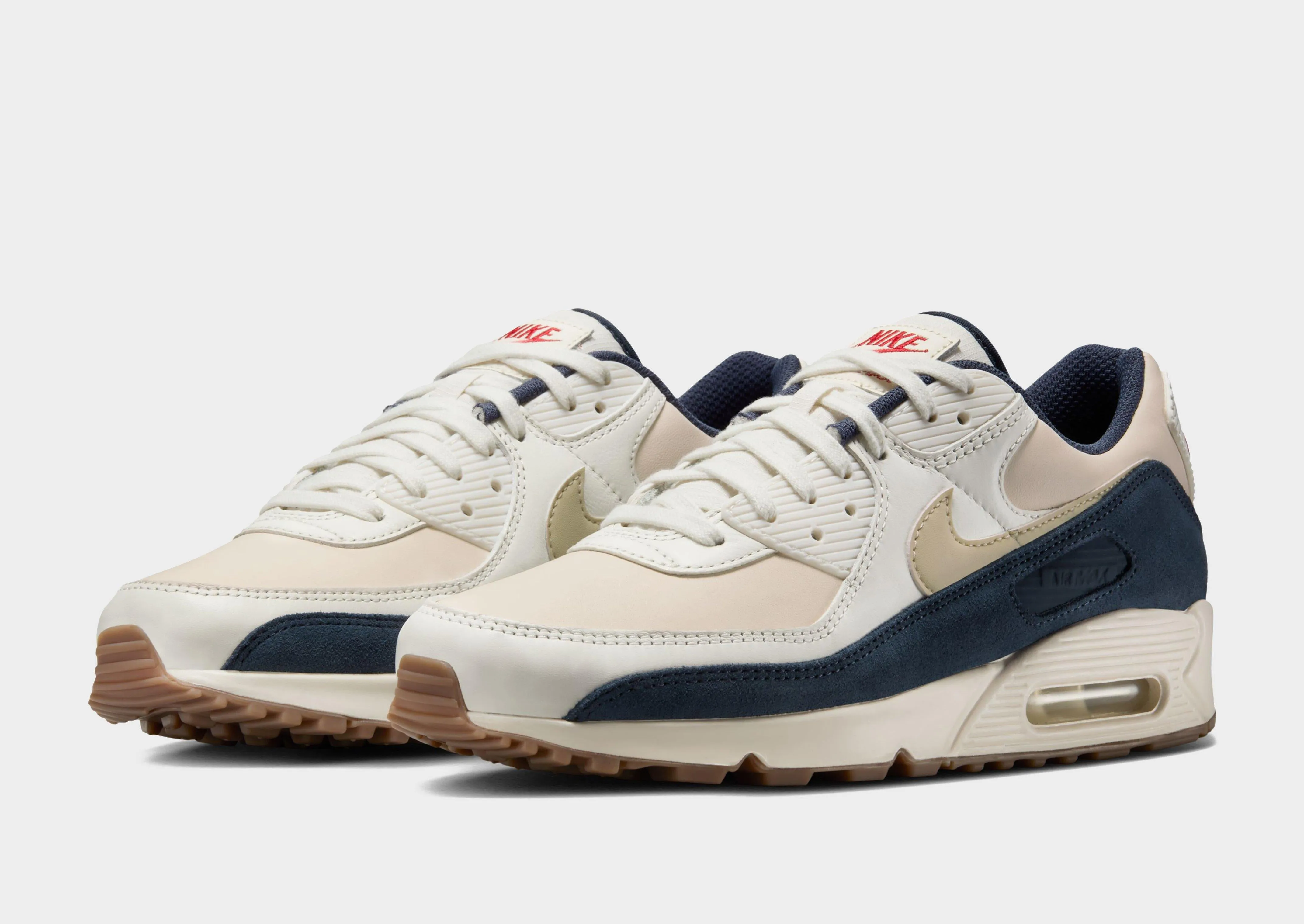 running in a basketball court area shoes Air Max 90