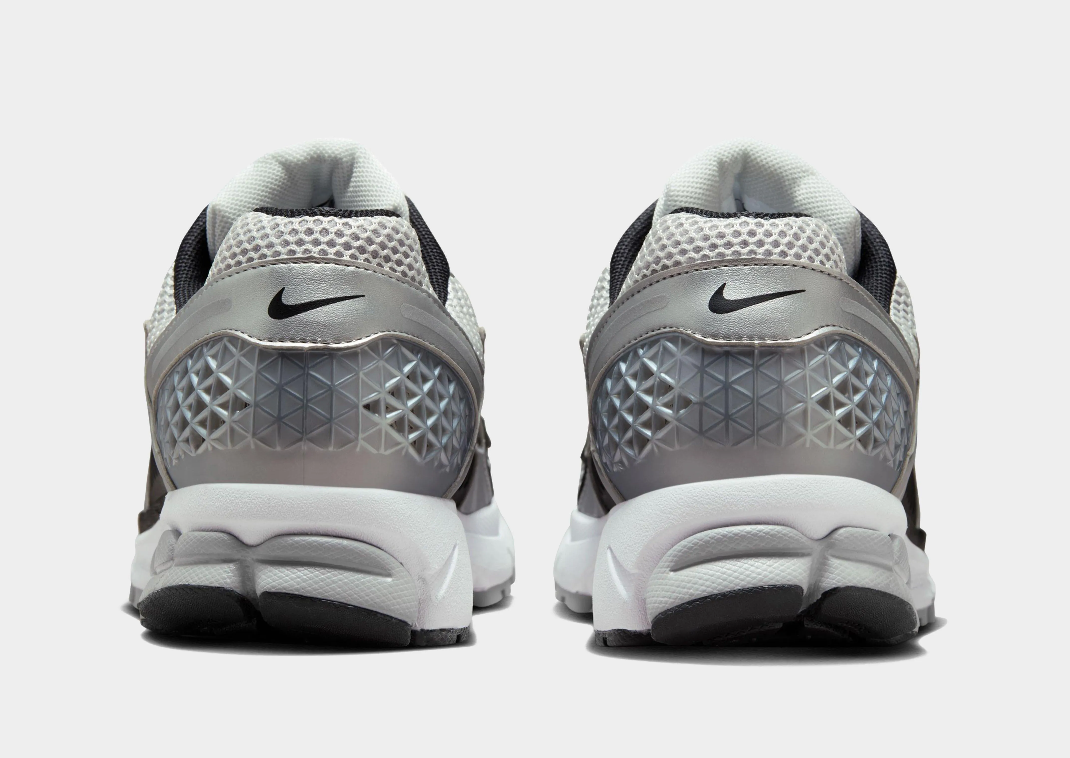Zoom Vomero 5 running in a suburban area shoes