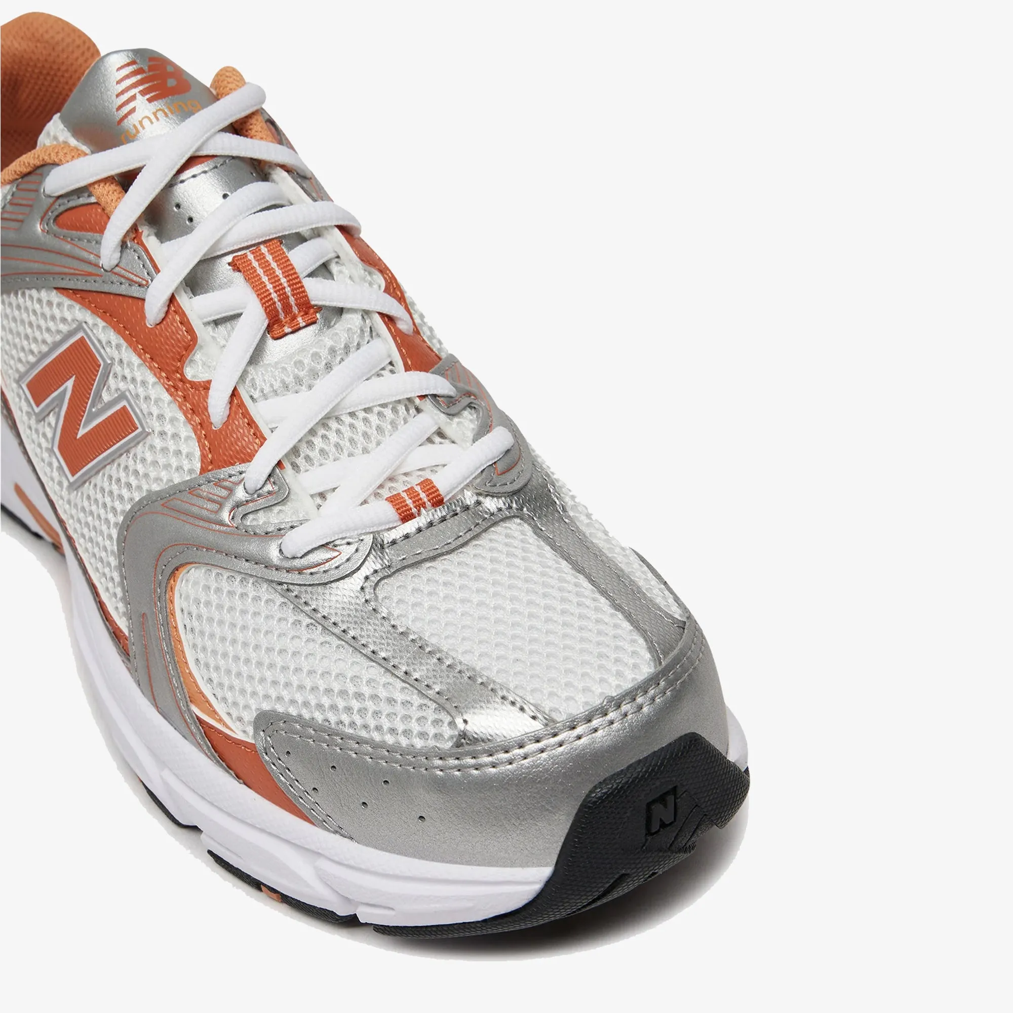 New Balance | 530 { ORANGE REFLECTION running in a waterfall area shoes