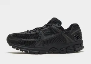 contoured footbed shoes running on a wooden track shoes Zoom Vomero 5